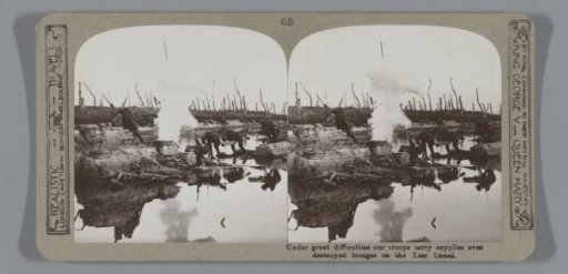 Under great difficulties our troops carry supplies over destroyed bridges on the Yser Canal
