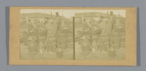 Men among barrels and basket bottles (presumably) in France