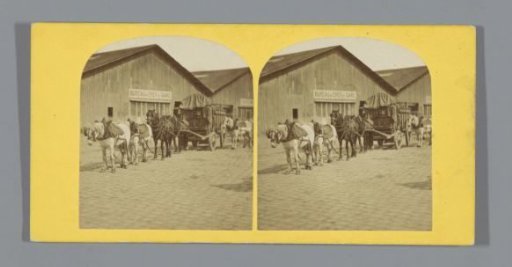 Horse-drawn wagon in front of a station building (presumably) in France