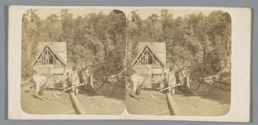 Persons beside a wooden cart in Normandy