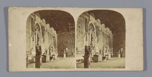 Interior of a hall with sculptures and chains in the Campo Santo in Pisa