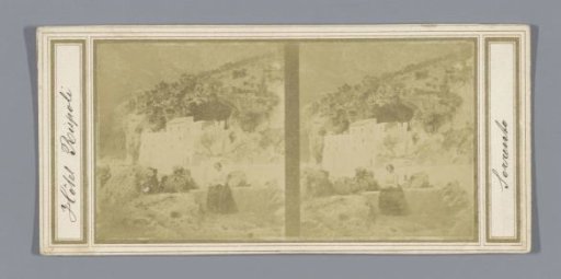 View of a building (presumably) in Sorrento, with a seated woman in the foreground