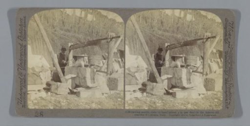 Man with a hand saw in the marble quarries of Carrara