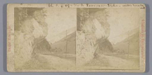 Mountain landscape with road under overhanging rocks in Russia