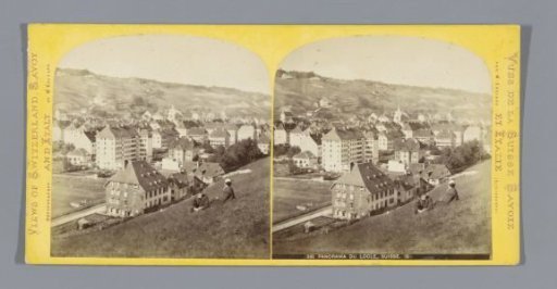 View of Le Locle with a man and a woman sitting in the foreground