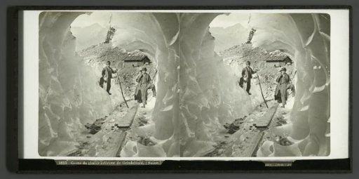 Two men and a woman, seen from a cave in the Lower Grindelwald Glacier in Grindelwald, Switzerland
