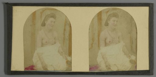 Half-naked woman with mirror in hand