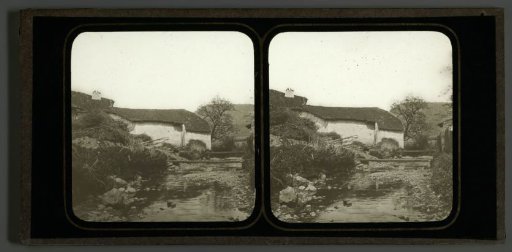 View of a building by a stream in Fécocourt, France