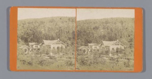 Several buildings among wooded hills, possibly Austria