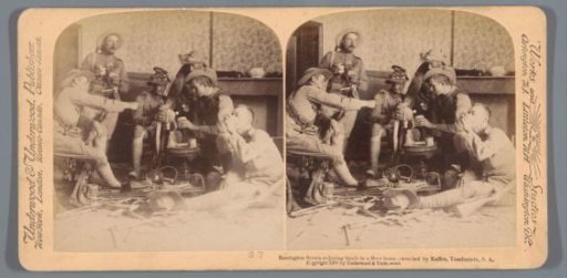 Scene of six men eating and drinking in a ruined house in South Africa