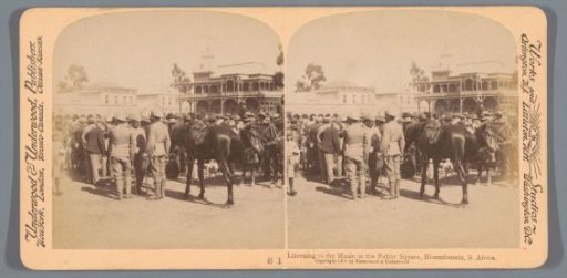 View of a square in Bloemfontein with a crowd and horses in the foreground