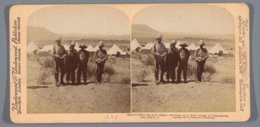 British soldiers and captured Boers posing near an army camp near Slingersfontein