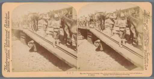 Staged scene of a cavalry regiment of the British army boarding a train in South Africa