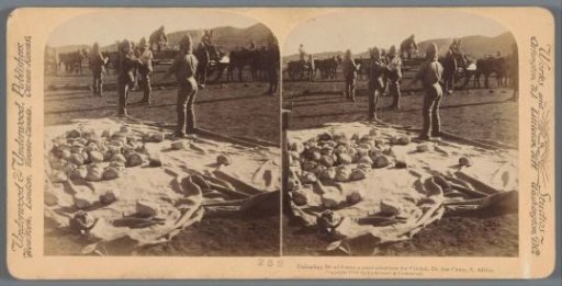 British soldiers loading bread from a cart in the camp at De Aar