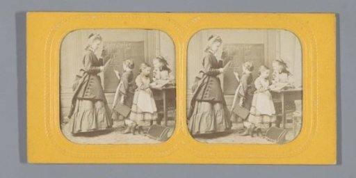 Teacher with three girls in a schoolroom