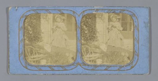 Woman and child on bed in garden, the woman possibly holding a camera