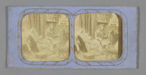 Man and woman in living room, man reading the newspaper