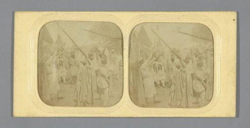 Men pointing with rifles into the air