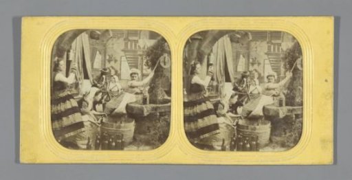 Three women filling bottles at a well