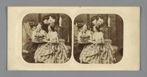 Two women at a table with a jewellery box