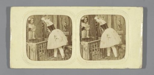 Young woman in a chemise before a mirror