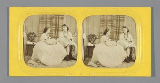 Two young women in a boudoir