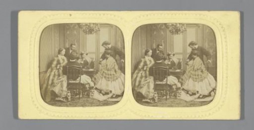 A group of people playing cards