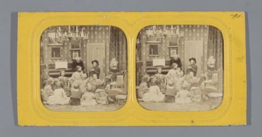 A group of playing girls, two men in the background