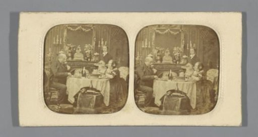 Dining couple with a servant