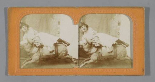Young woman on a fairground bull
