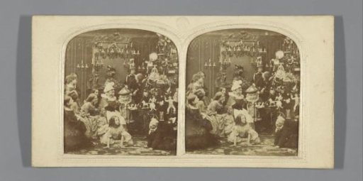 Children around a Christmas tree with dolls