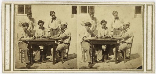 Men playing dominoes at a table