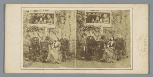 Group portrait of a family in front of a house