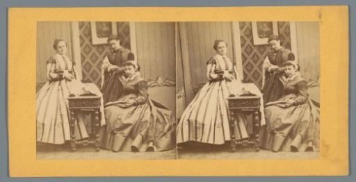 Three women with sewing materials