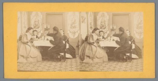 Man and four women around a table
