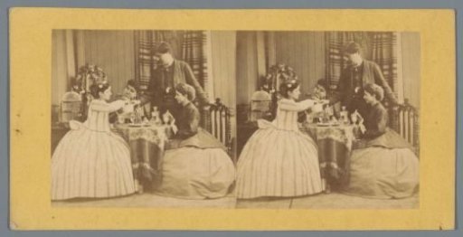 Three women and a man at a table with glasses