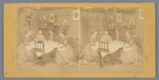 Three women and a man around a table