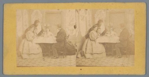 Company around a table with glasses and a candelabrum