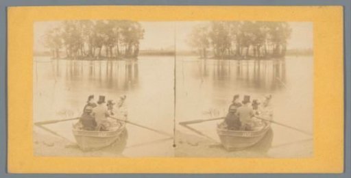 Company in a rowing boat on a lake