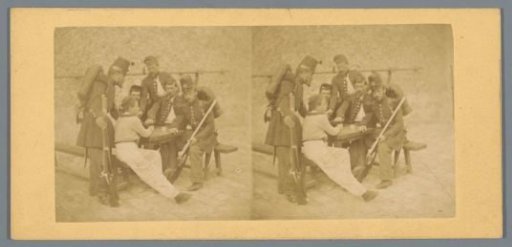 Soldiers at a table in a courtyard