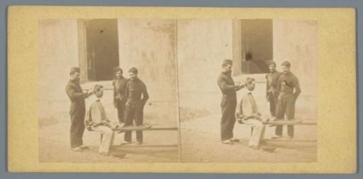 Soldiers cutting each other's hair in a courtyard