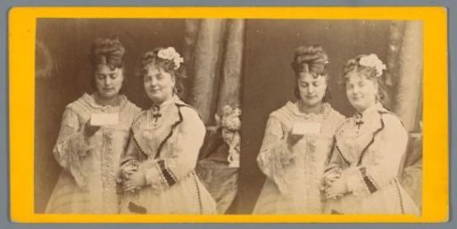 Two women with a letter, the woman on the right looking at the camera