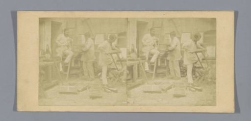 Three carpenters in a workshop