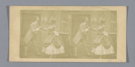 Man holding the hand of a woman, possibly proposing to her