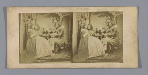 Two couples sitting on each other's laps in historical costumes