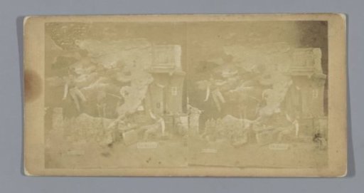 Staging of dolls in a setting, representing a dream with falling men, a ruin and a skeleton