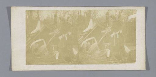 Theatrical performance of a soldier stabbing an armed figure with a lance