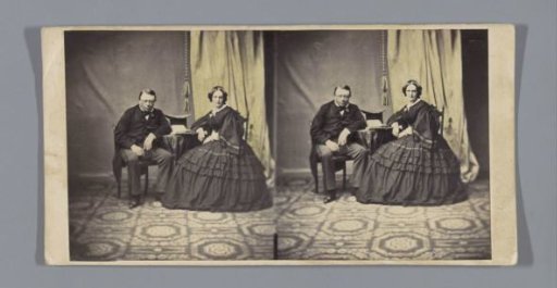 Portrait of a man and a woman at a table