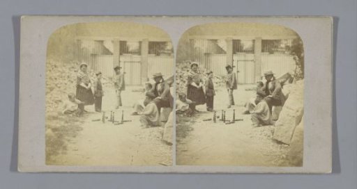 Group playing skittles in the street