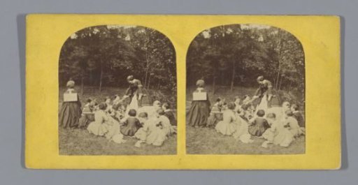 Class of schoolgirls and a teacher on the grass